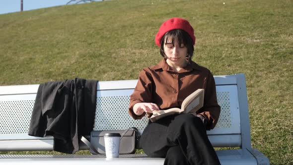 Reading Novel On Bench