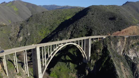 Cars move across the bridge.