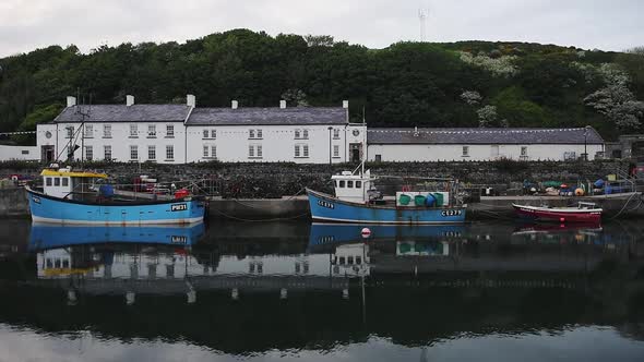 Boats Docking In The Harbour In Rathlin Island, Ireland - Medium Shot