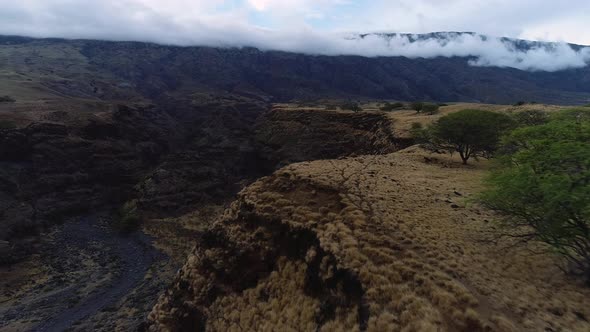 Drone flying over mountain ridge on Maui, Hawaii.
