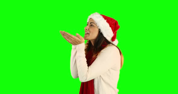 Woman in santa hat and warm clothing blowing over hands 4k