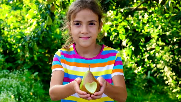 The Child Eats a Pear in the Garden