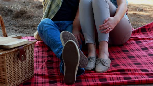 Couple interacting with each other in olive farm