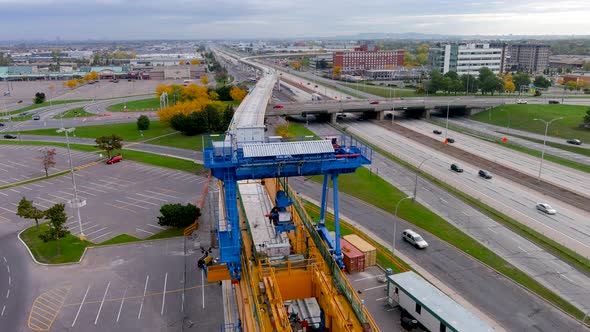 4K camera drone view of the construction site of the REM (Metropolitan Express Network) in Montreal.