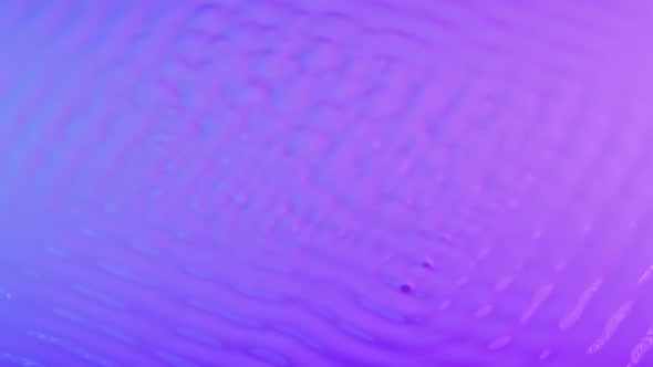Wave Motion of Pink Blue Surface of Viscous Milky Liquid When Excited By Vibration
