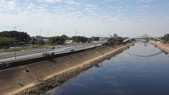 Tiete river reflecting the sky, on Marginal Tiete  highway in Sao Paulo, Brazil