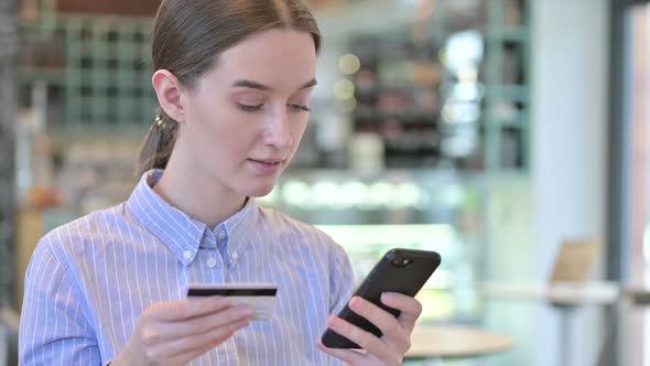 Portrait of Online Payment on Smartphone By Young Businesswoman