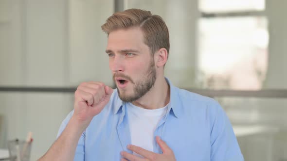 Portrait of Sick Young Creative Man Coughing