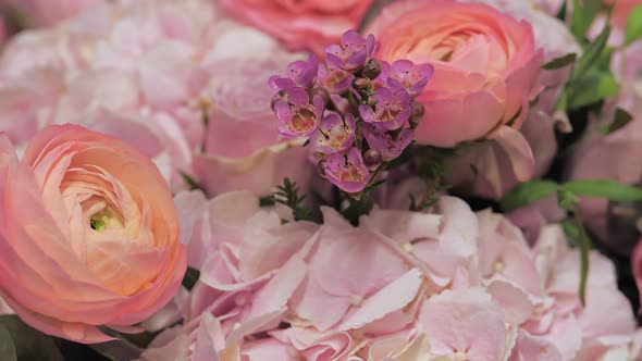 Closeup of Bouquet with Pink Roses and Mountain Heather Flowers