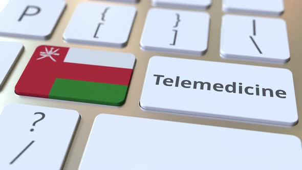 Telemedicine Text and Flag of Oman on the Computer Keyboard