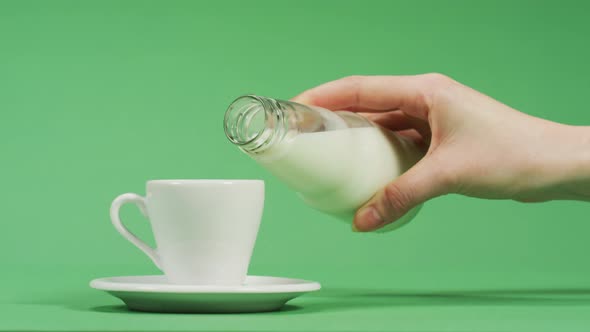 Pouring milk into coffee