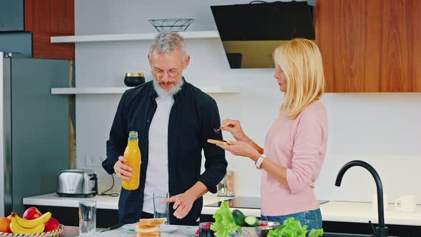 Portrait of a Happy Mature Couple in the Kitchen