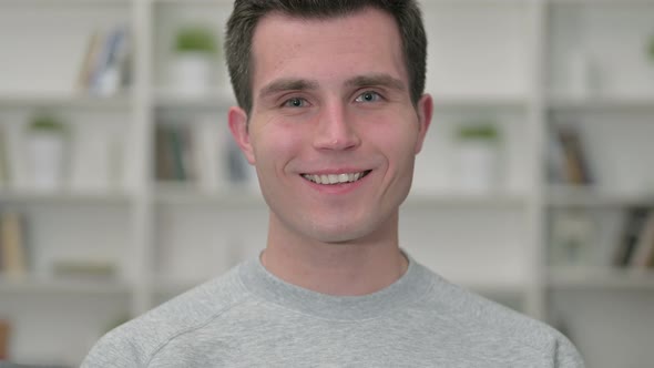 Portrait of Smiling Young Male Designer Looking at the Camera 