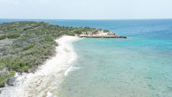 Ocean Waves Crashing On Rocky Coast Of Isla Cabra In Montecristi, Dominican Republic. - aerial