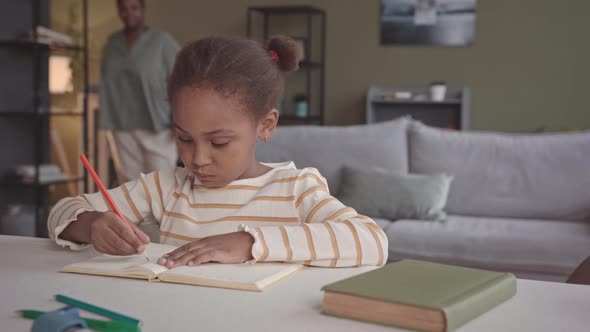 5 Year Old Girl Studying at Home