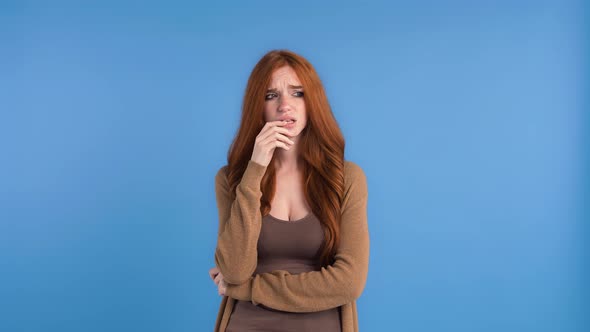 Redheaded Model in Brown Tshirt and Cardigan