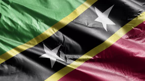 Saint Kitts and Nevis textile flag waving on the wind. Slow motion. 20 seconds loop.