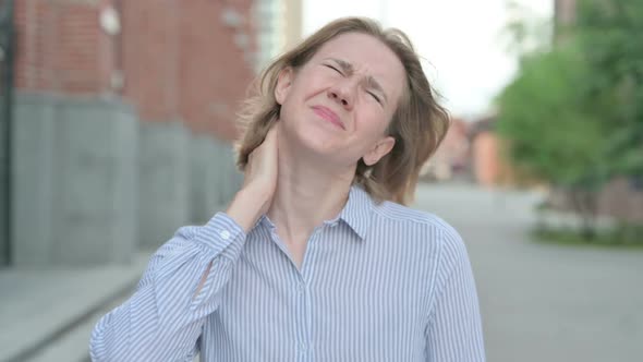 Portrait of Woman Having Neck Pain Outdoor