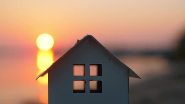 House Model Against the Sunset