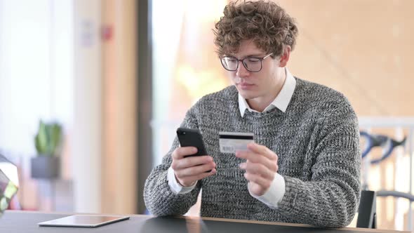 Online Shopping Success on Smartphone By Young Man 