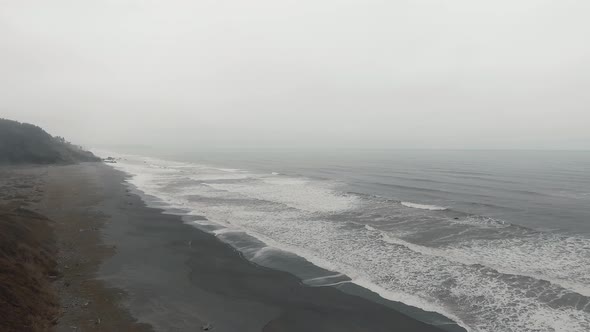 Footage of ocean waves on a shore into fog in Sharp Point at Dry Lagoon State Park, California, USA