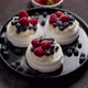 Delicious Mini Pavlova Meringue Desserts Served with Frozen Frosty Berries - VideoHive Item for Sale