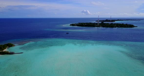 Beautiful aerial abstract shot of a summer white paradise sand beach and blue ocean background in 4K