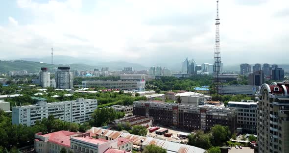 Top View of Almaty City. Green Streets, Big Clouds