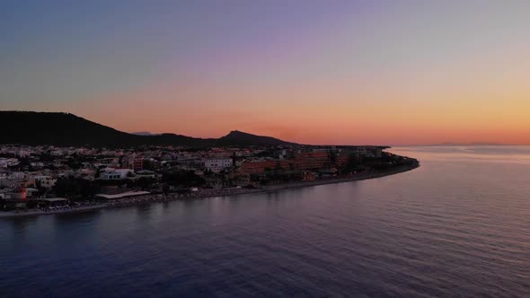 Sunset Scenery At The Coastal Town Of Ialysos On Rhodes, Greece - aerial drone shot
