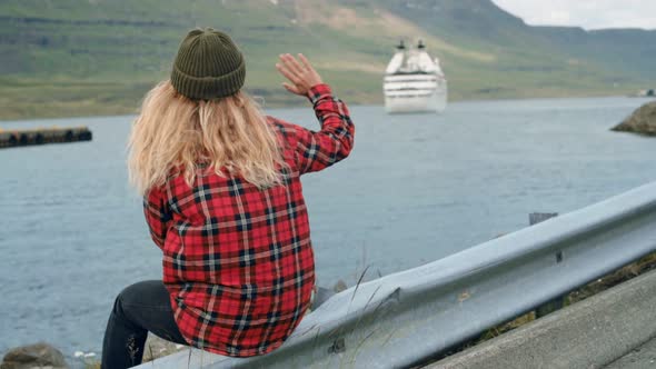 Young Woman Sits in Port Watch Cruise Ship Leave