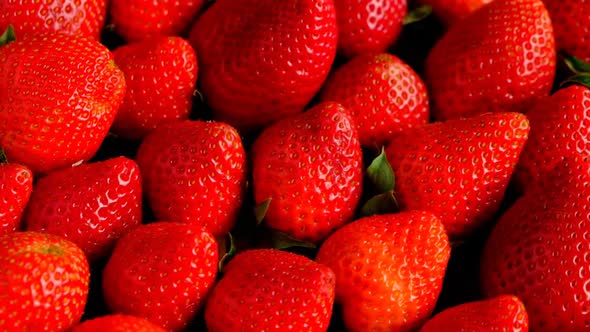 Strawberry background. Large ripe strawberries close-up.