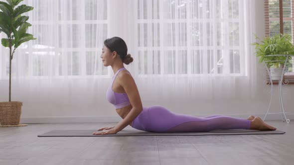 Close up.Asian woman practising yoga, Cobra exercise