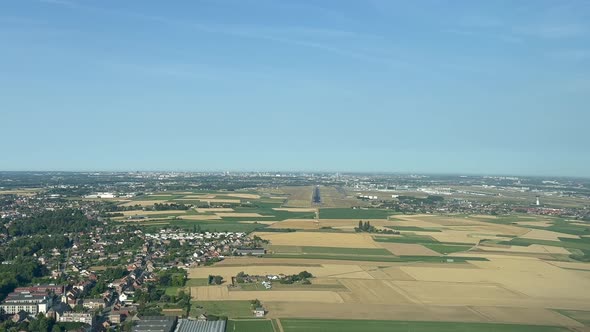 Unique aerial view from a jet cockpit during the approach to Brussels Airport (Belgium) in a splendi