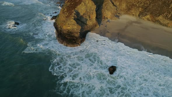 Coastal erosion of the cliffs along the coastline, drone aerial shot
