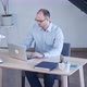 Handsome Businessman Working with Laptop in Office - VideoHive Item for Sale