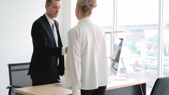 Job Seeker and Manager Handshake in Job Interview