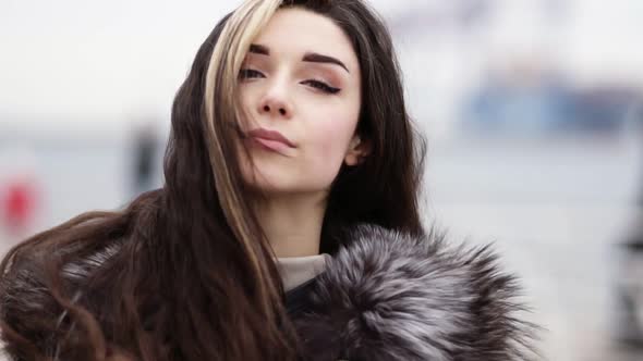 Closeup View of Young Attractive Woman's Face Looking in the Camera and Walking