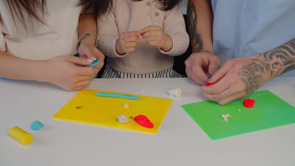 Human Hands Sculpting From Child's Play Clay