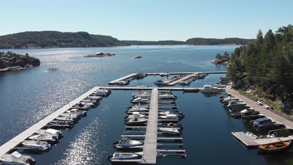 Beautiful remote harbour on coastal fjord in summer, aerial view