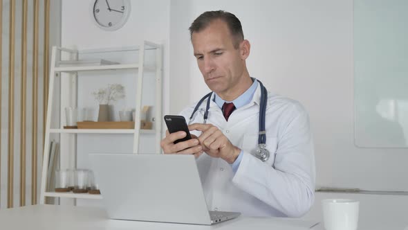 Doctor Using Smartphone for Internet