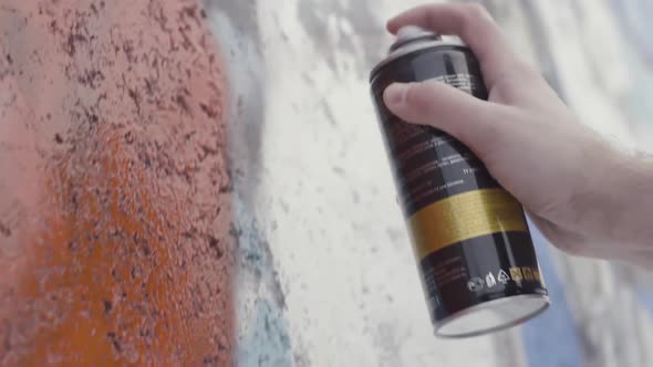 Hand Holding A Spray Paint