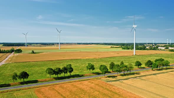 Aerial view of wind turbines on summer field in Poland