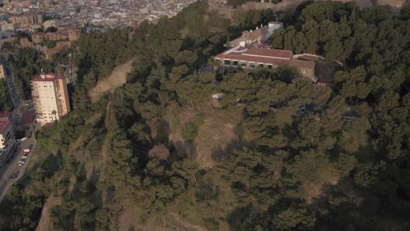 Aerial view of a hill and the city of Malaga