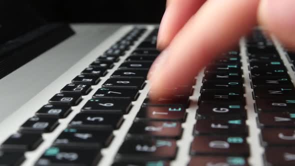 Hands of an Office Worker Typing on Keyboard, Close Up, Cam Moves To the Right, Black