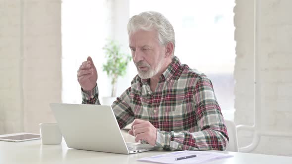Video Chat on Laptop By Casual Old Man