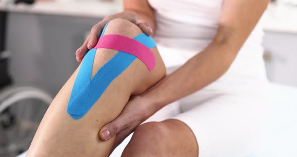 Therapeutic Kinesio Tape Applied to Patient Leg Slow Motion  Movie