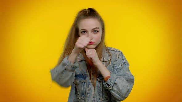 Aggressive Teen Girl Trying to Fight at Camera Shaking Fist Boxing with Expression Punishment