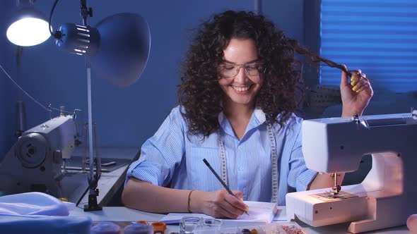 Portrait of a Young Girl Designer Working in Her Studio