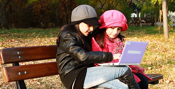 Two Girls Playing On Laptop 3
