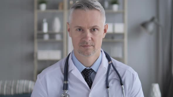 Portrait of Senior Doctor with Grey Hairs